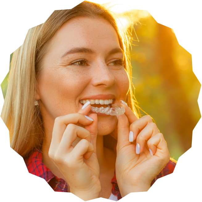 woman inserting clear aligner
