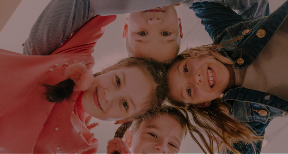 kids smiling in a circle